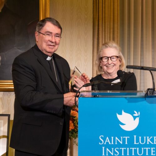Chair of the Saint Luke Institute Board of Directors, Christine M. Gill, Esq., presents the Saint Luke Award to our host and honoree Christophe Cardinal Pierre at our 2024 Annual Benefit.
