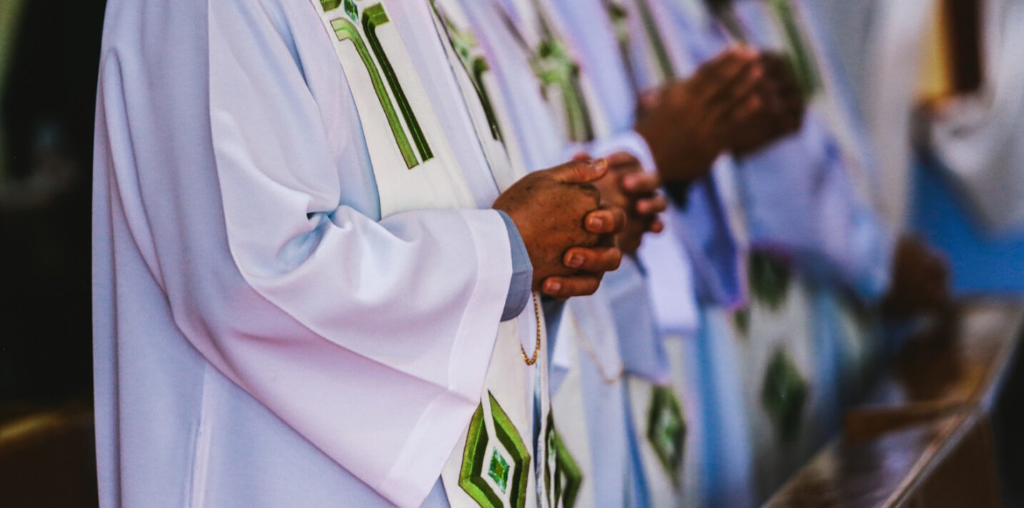 Hands of the priest during the celebration of the Holy Communion.