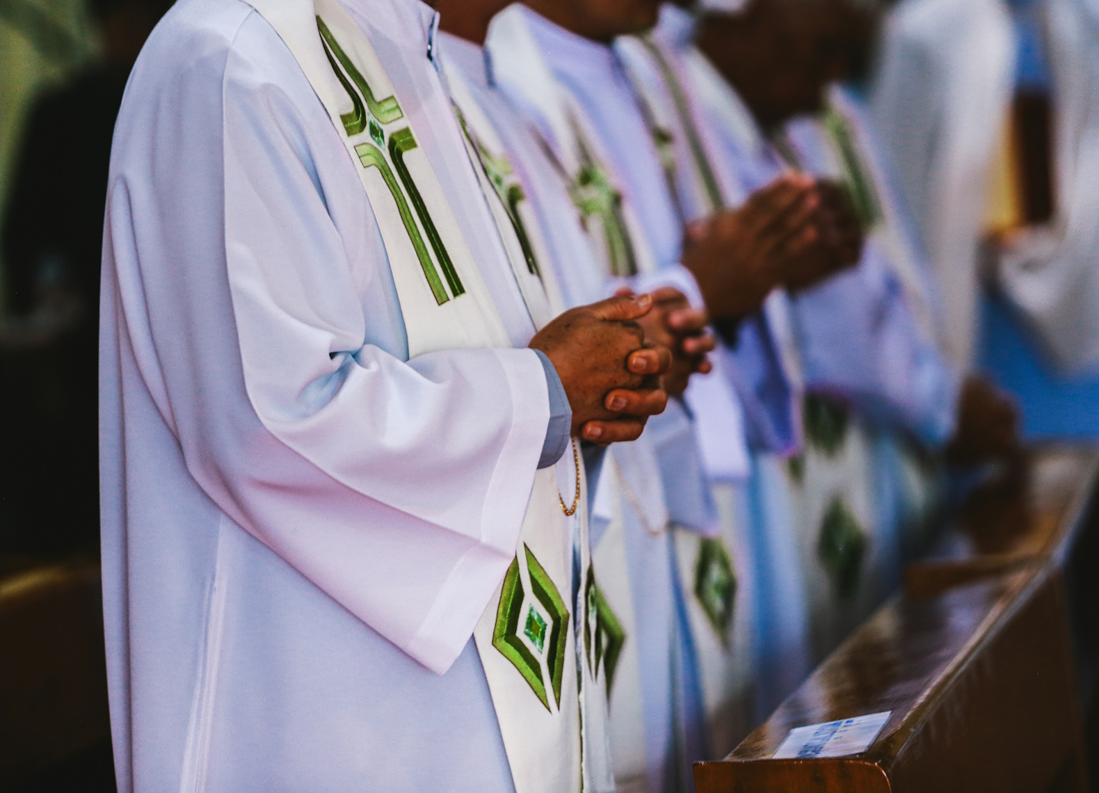 Hands of the priest during the celebration of the Holy Communion.