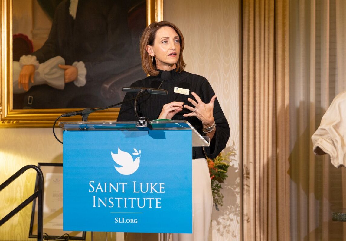 Emily Cash, Psy.D., Director of Saint Luke Center in Louisville, addresses those gathered at the 2024 Annual Benefit.