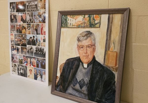 Painting of Fr. John Crossin on display at the WTC event along with family photos