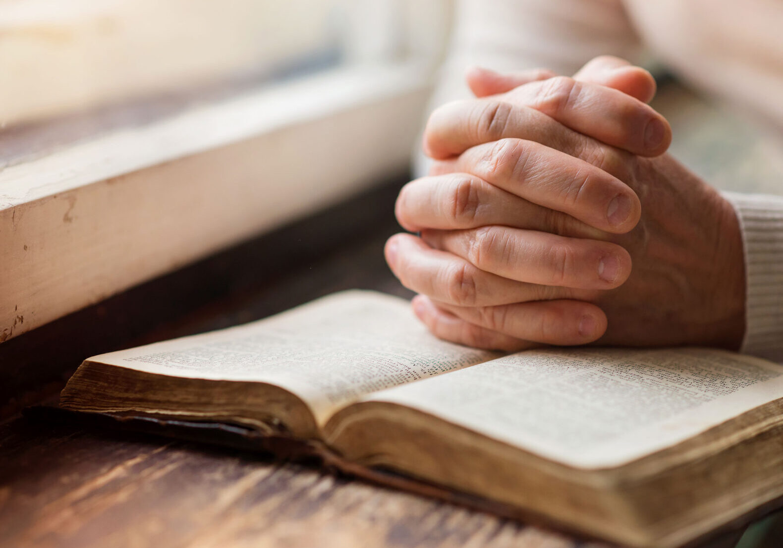 reading-praying-bible-older-hands