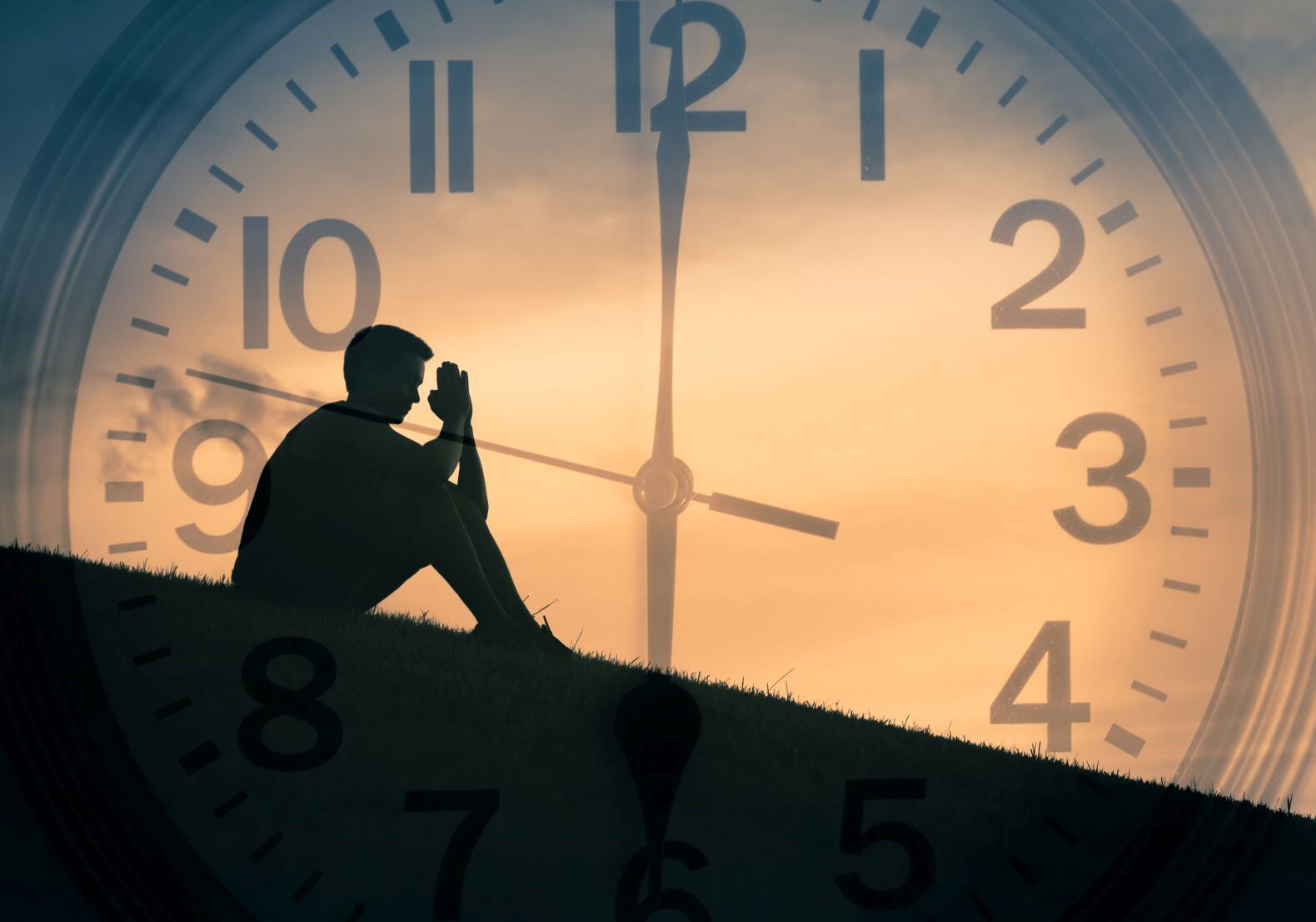 Double exposure of young man praying outdoors with clock in the background.